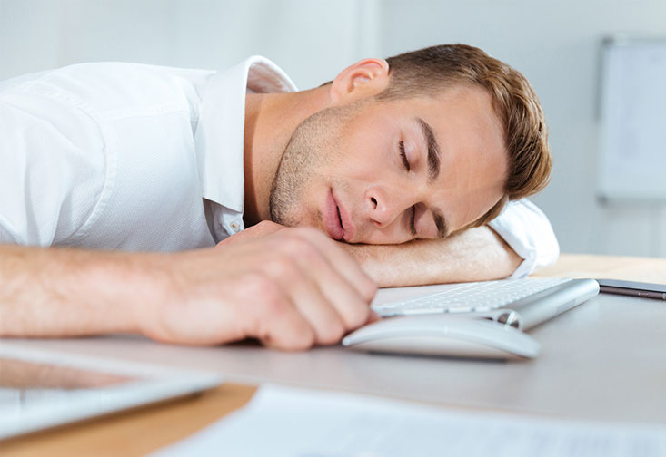 Man sleeping on a keyboard
