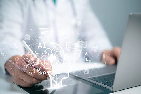Doctor sits at computer with AI graphics in front of him
