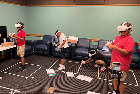 Students using virtual reality to create video games