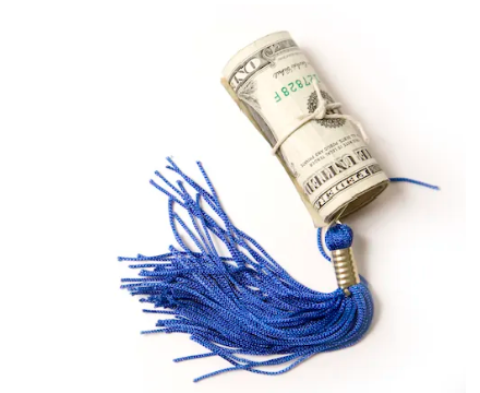 Dollar bills with graduation tassel attached