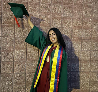Woman with graduation cap and gown