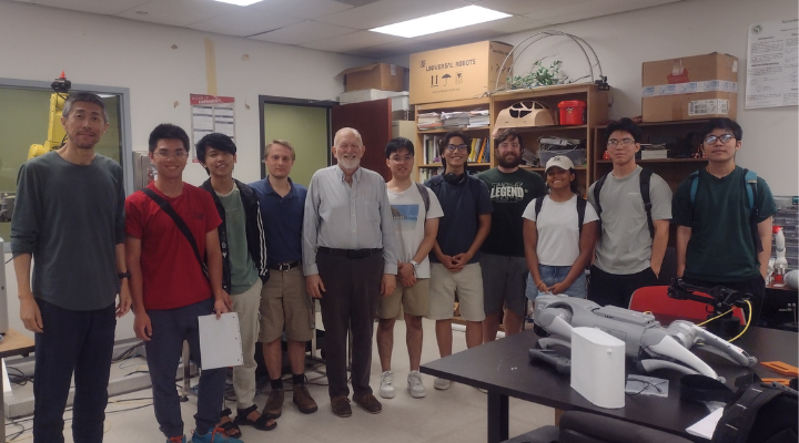 Dr. Sun and Dr. Kearn standing with students